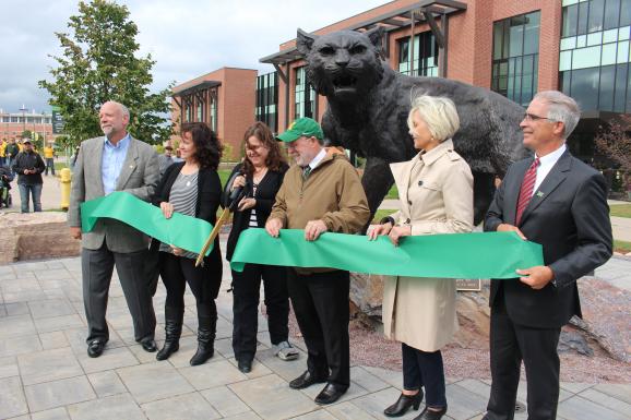 Wildcat statue ribbon cutting