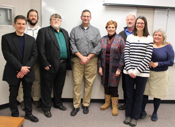 Andary with surprise messengers (from left) Kappa, Lucas, Eslinger, Schuiling, Centko, Blanck and Kimball.