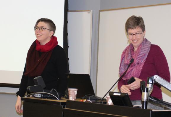 Emily Wros (left) receives the Library and Archives Research Award from Dean Leslie Warren.