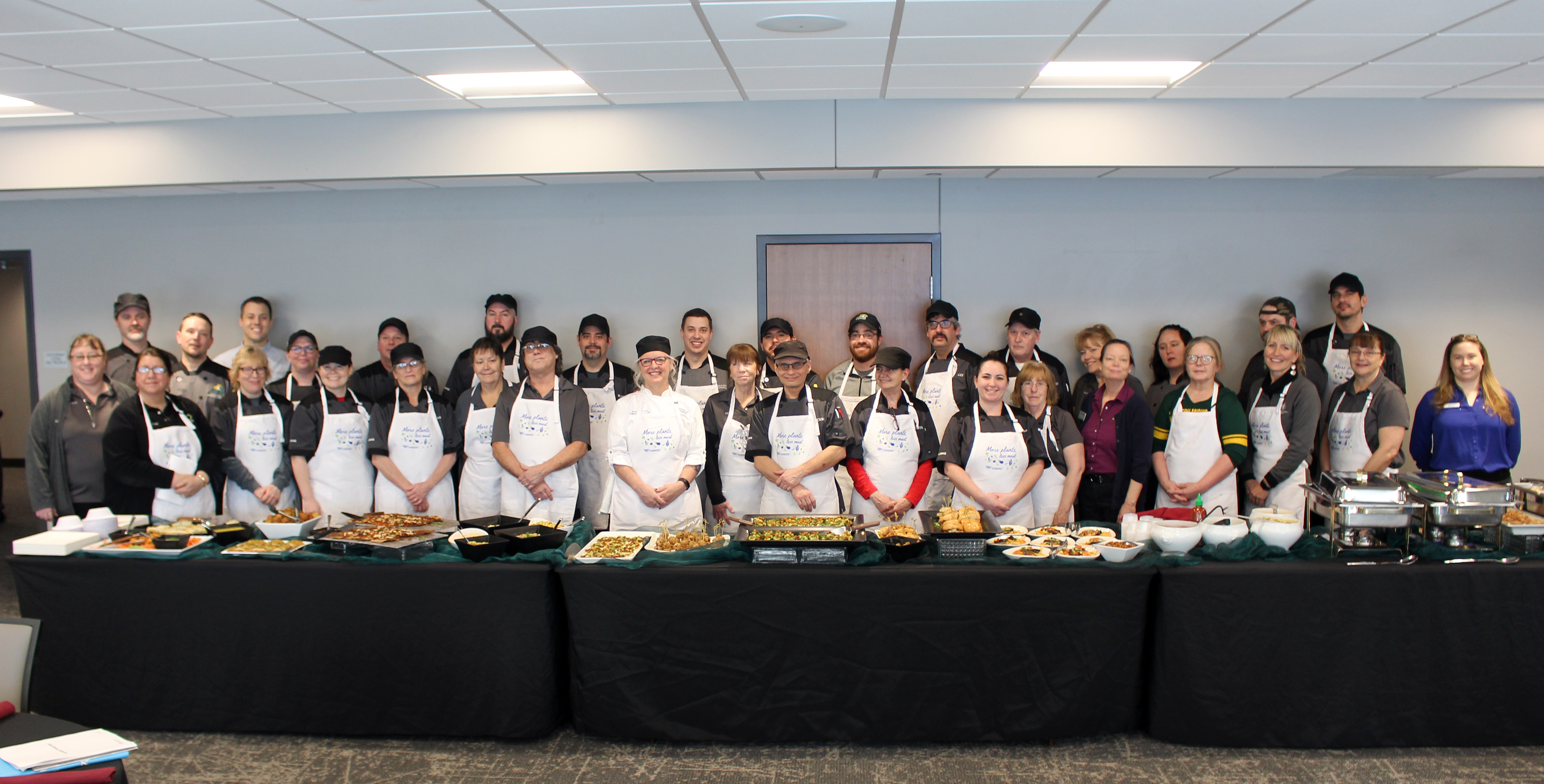 Dining staff with lunch items they prepared.