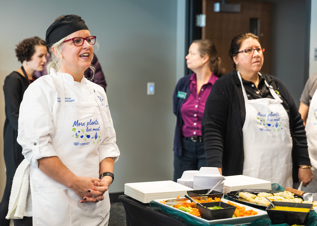 Forward Food's Webster (left in apron) addresses the staff