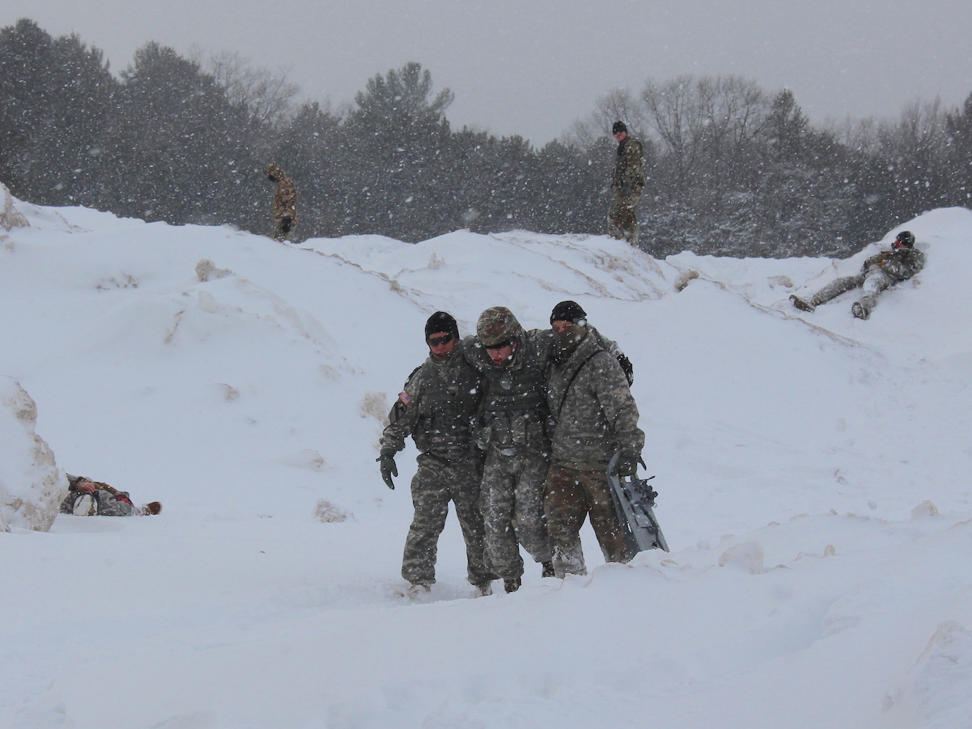 Cadets transport wounded from the field.