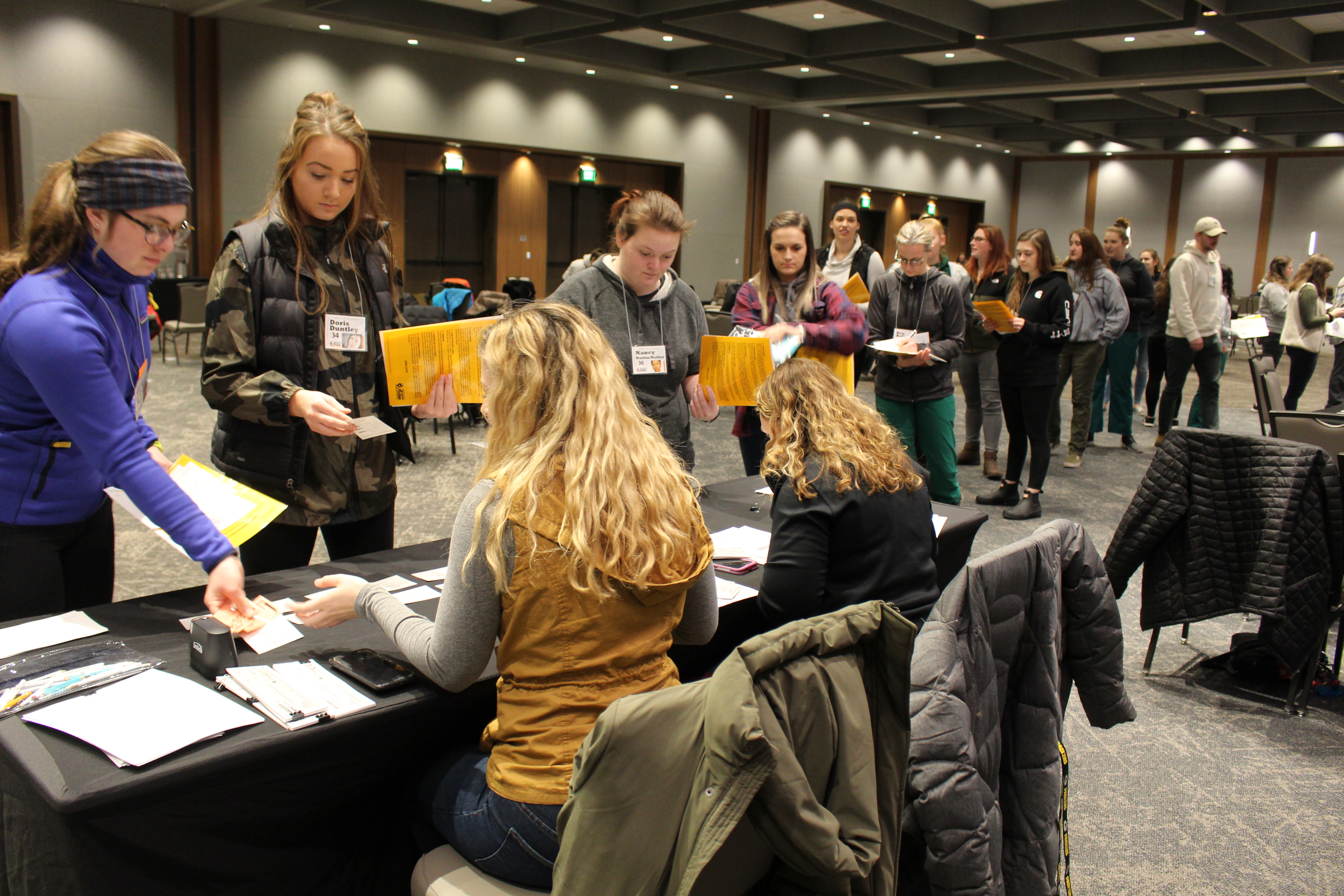 Participants wait in line at an employer.