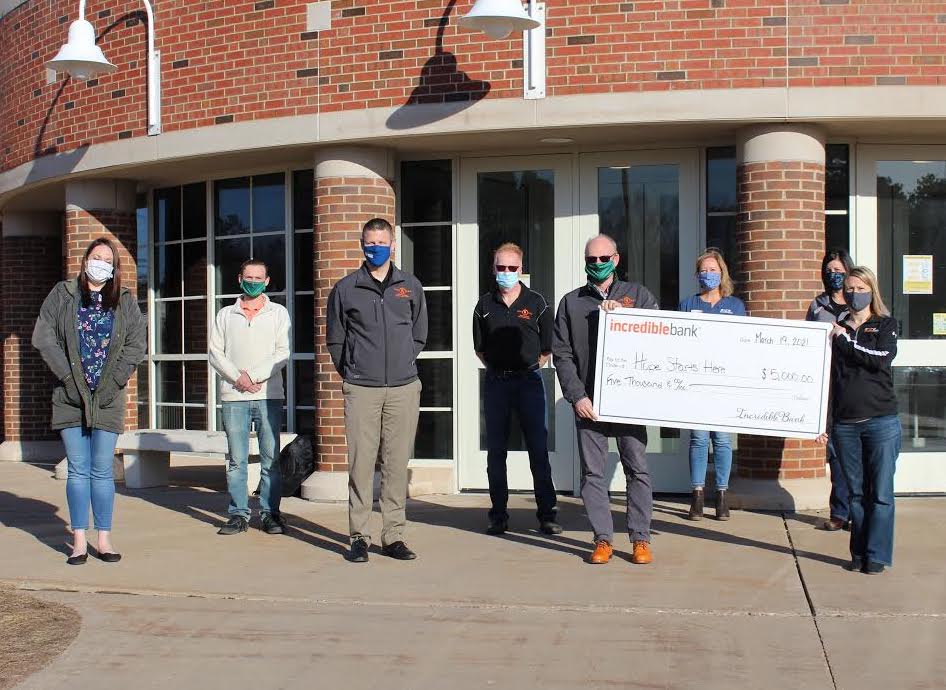 (from left): Jamilyne Spruytte (UPHS Clinic Admin), Dan Raymond (UMBTC lab director, NMU), Shane Kentala (UPHS Brain and Spine), Paul Mann (NMU associate dean and director of Clinical Sciences), Rob Winn (NMU dean of the College of Arts and Sciences and UMBTC co-founder), Michelle Sellers (IncredibleBank business banker), Ashley Cody (IncredibleBank market vice president) and Karen Shaneberger (IncredibleBank assistant market manager).