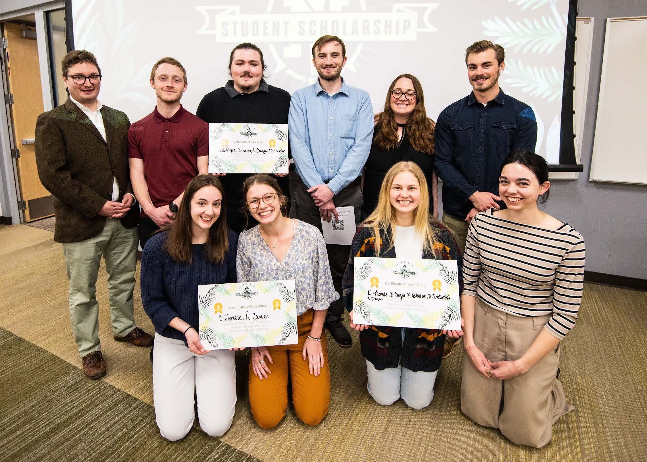 Group Project winners (Front L to R: Christina Ferrera, Anne Carrier, Bella Enger, Nicole Thomas) Back L to R: Dr. Forrest Toegel, Ender Harris, JD Payne, Brandon Godin, Dr. Cory Toegel, Andrew Donar