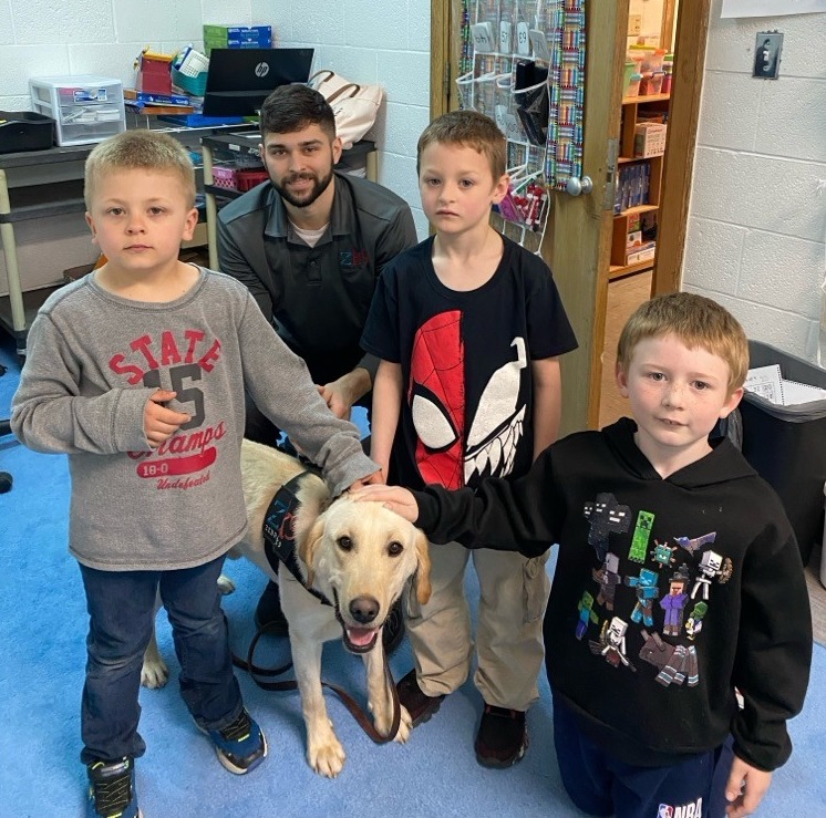 Handler Carlos with K9 Gator and Rudyard students