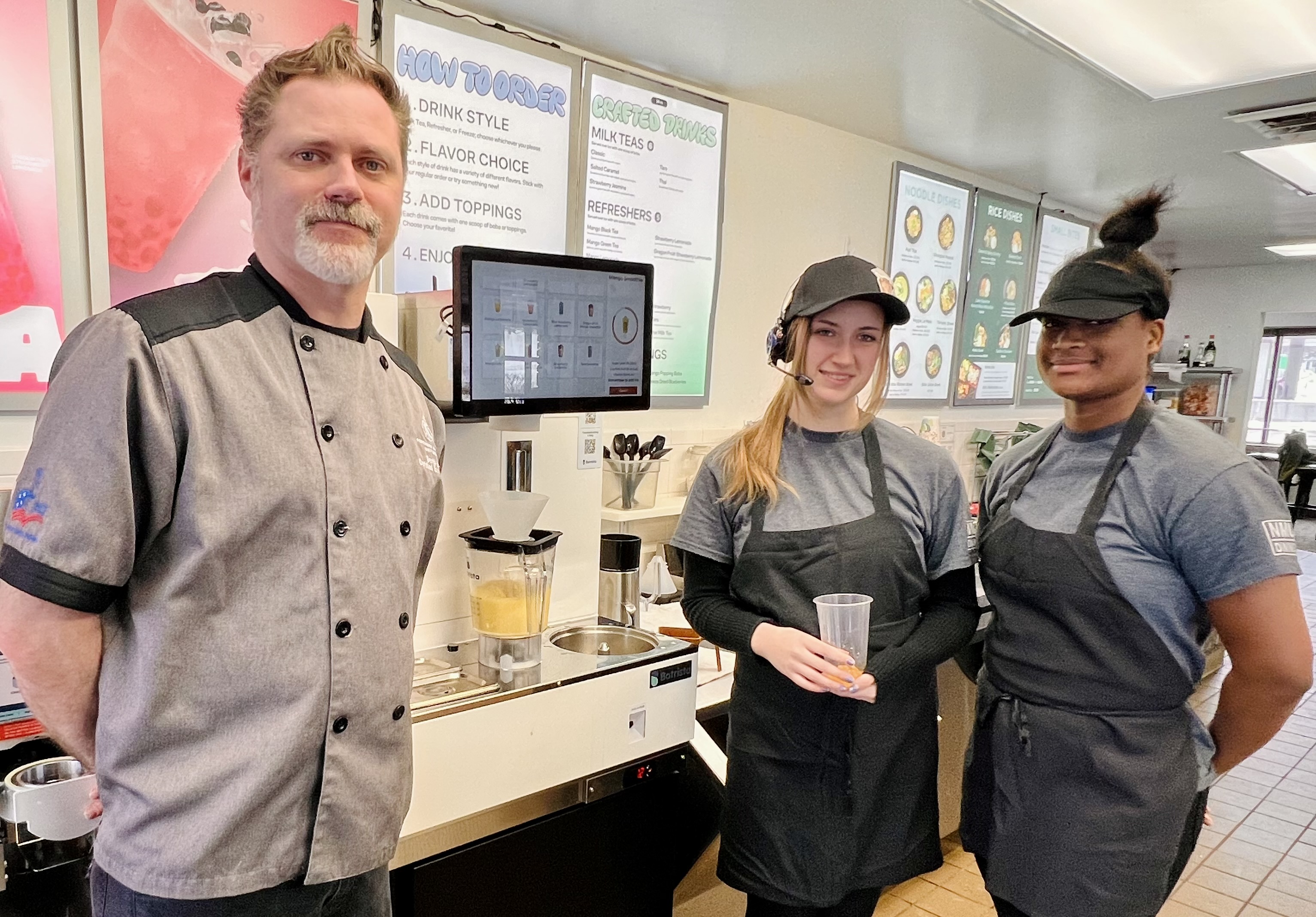 Estes, McCully and Harvey by the robotic drink-making machine