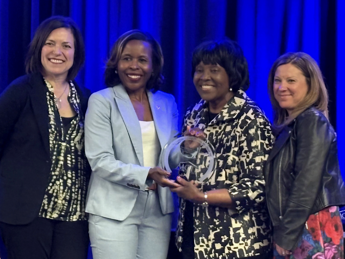 White (far right) receiving the book award with coauthors (from left): Dr. Ann Castle, Dr. Monika W. Shealey and Dr. Patricia A. Edwards