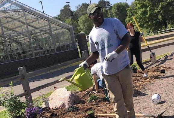 Future NMU student planting a garden