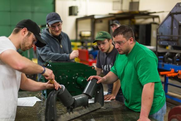 Stock photo of students working in a shop