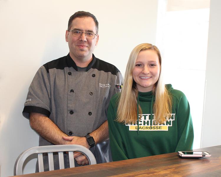 Shane Hawkins of NMU Dining and Tess Kostelec