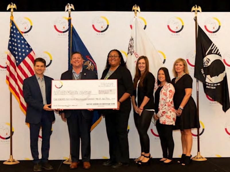 NMU Associate Provost Dale Kapla is pictured with NAHF Board of Directors Jamie Stuck, Dorie Rios, Elizabeth Kinnart, Kimberly Vargo and Melissa Kiesewetter at the check presentation ceremony.