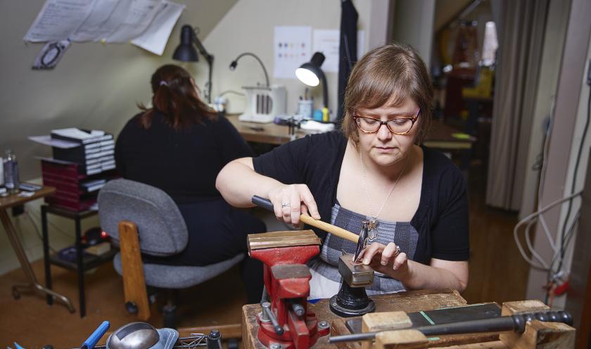 Millner and an assistant in the studio (NMU file photo)