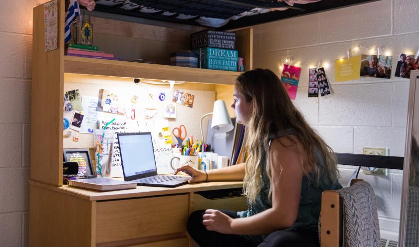 Student studying in residence hall (stock photo)