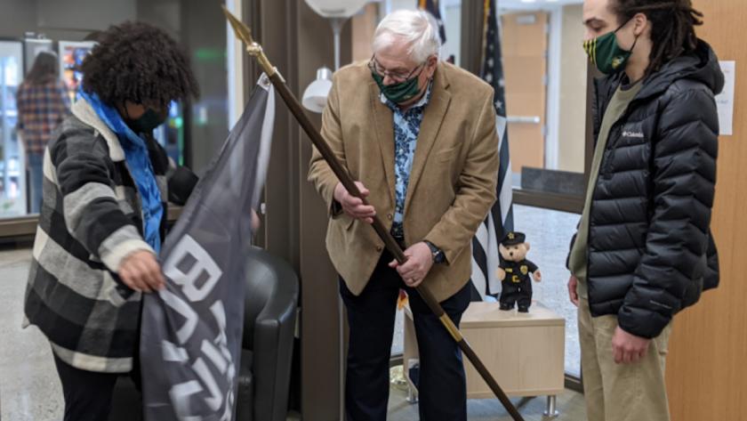 BSU members present a Black Lives Matter flag to Hanson (North Wind photo)