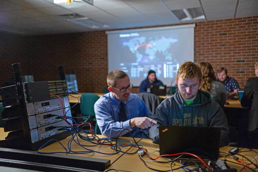 Marquardson (left) with a student (file photo from 2018)