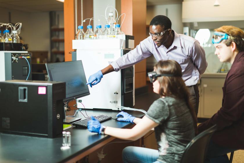 NMU faculty member and students in a medicinal plant chemistry lab.