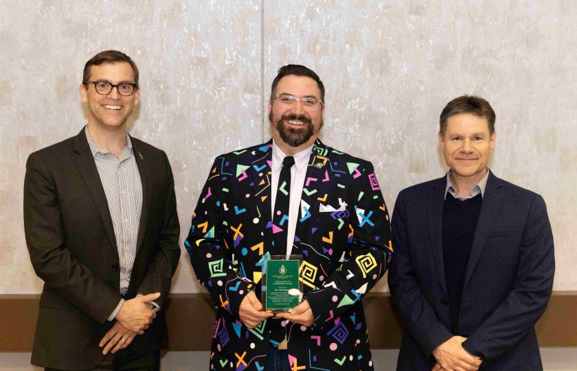 Digneit (center) with President Brock Tessman and Interim Provost Dale Kapla