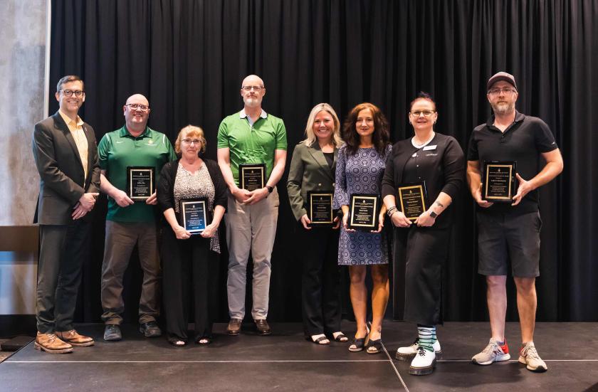 President Tessman with Excellence in Service Award winners Roo, Shaw, Cullen, Riipi, Koski, Hamari and Buckmaster. Not Pictured: Nicole Walton