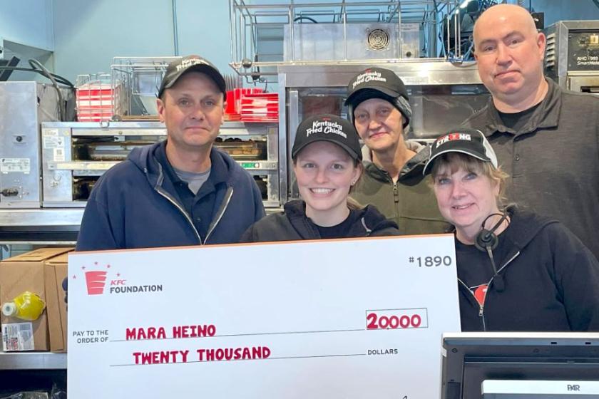 Heino (front center) with KFC team members in Marquette.