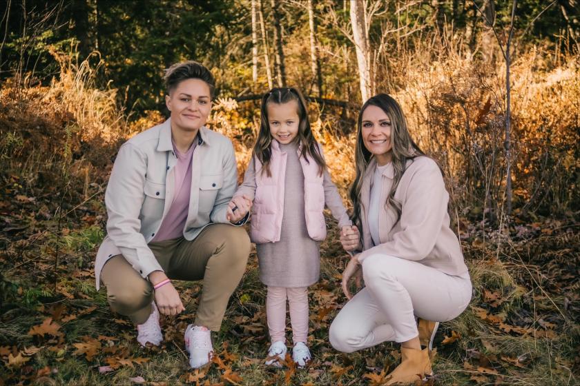 Brigitte (right), with wife Mariah and daughter Amya.