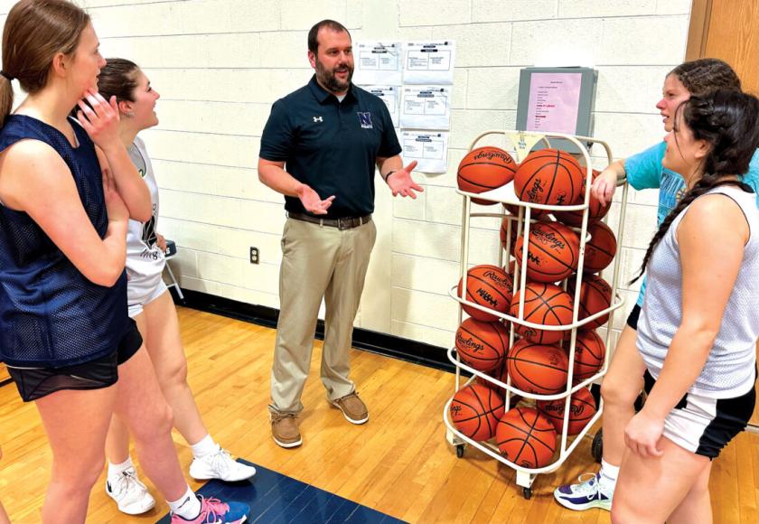 Tinti talks with girls basketball team members (Terri Castelaz/Daily News photo)