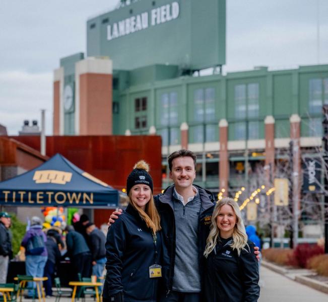 Corgan (center) outside Lambeau Field