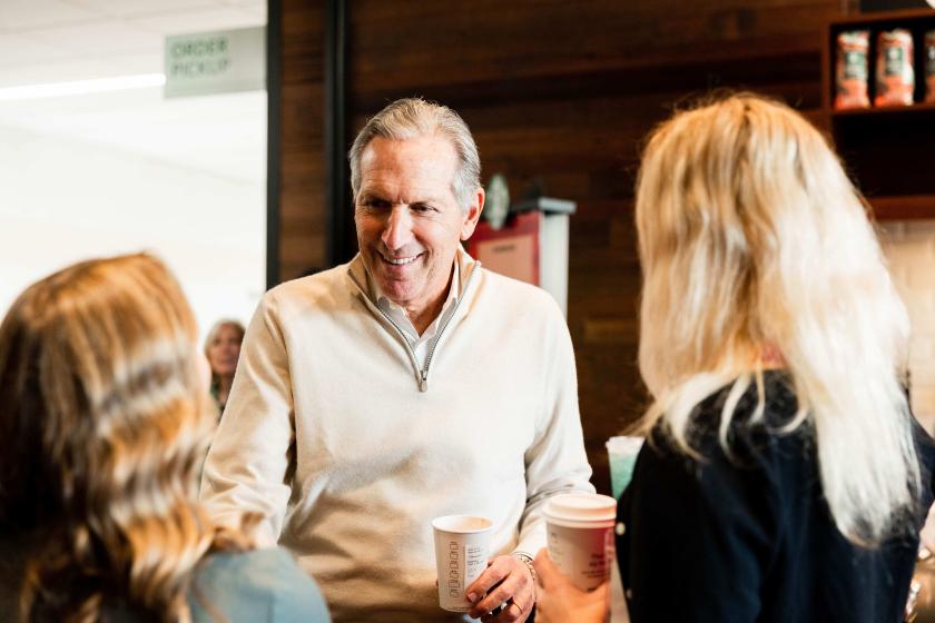 Schultz interacting with students in the campus Starbucks during his October visit