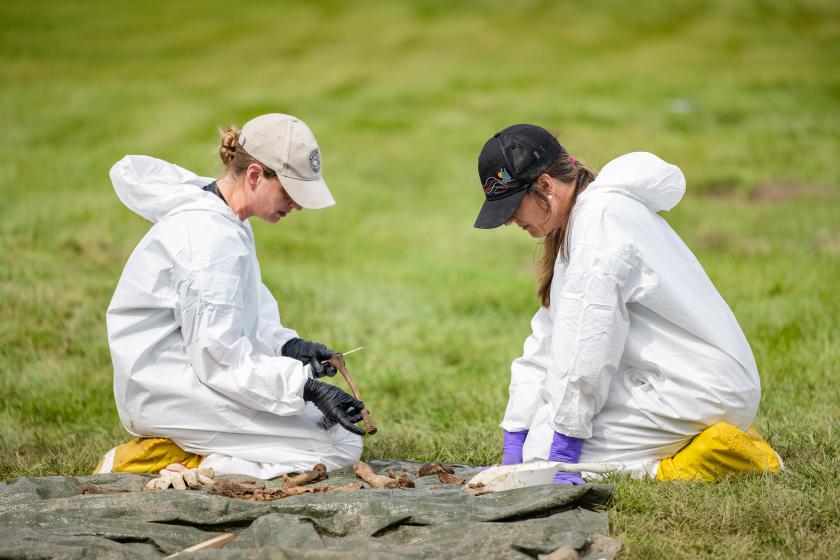 Harris (left) with Dr. Carolyn Isaac of MSU, collaborating on the assessment of one of the victims.