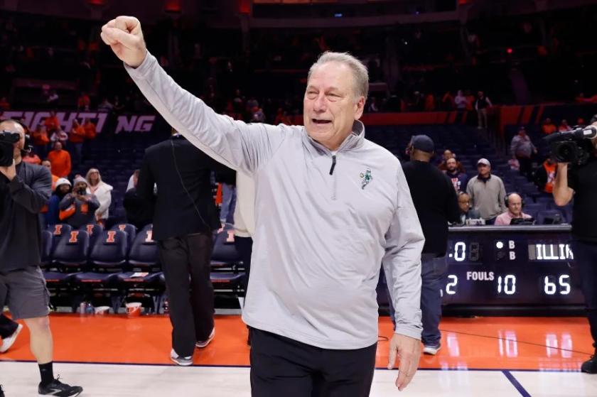 Tom Izzo motions to fans after his record-setting win