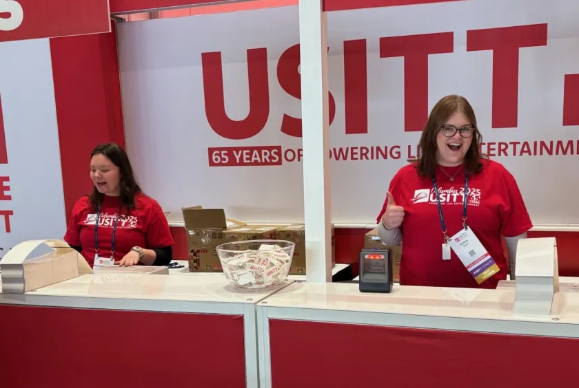 Molly Sobiechowski and Ashley Reinhart working the registration booth as conference assistants.