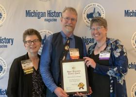 From Left: Sharon Carlson, award presenter; Marcus Robyns, university archivist and UPLINK project director; and Leslie Warren, NMU interim associate provost and dean of Library and Instructional Support