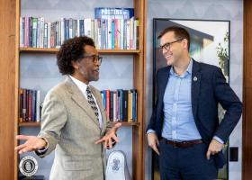 Joseph Baynesan of the Michigan Department of LEO-WD (left) meets with NMU President Brock Tessman on campus.