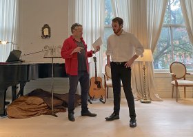 NMU senior Liam Fisher (right) receiving constructive critique from composer/lyricist Adam Guettel