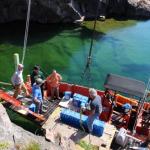 Image of members unloading batteries from a boat