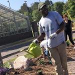 Future NMU student planting a garden