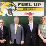 NMU President Fritz Erickson, Marquette Meijer Director John Spaulding, NMU Athletics Director Forrest Karr and Wildcat volleyball player Sarah Kuehn