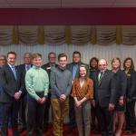 From left: Trustee Tami Seavoy, NMU Board Chair Robert Mahaney, Connor Loftus, Trustee James Haveman, Ryan Watling, Trustee Stephen Young, Michael Stamm, Kevin Store, Hailey Donohue, Trustee Bridget Summers, NMU President Fritz Erickson and Trustees Alexis Hart, Lisa Fittante and Steve Mitchell.