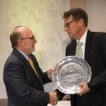 Mommaerts (right) receives his award from NMU President Fritz Erickson