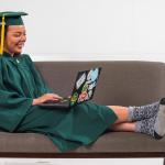 Graduate with computer (NMU stock photo)