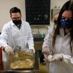 Hillhouse (left) with students in his lab (UWGB photo)