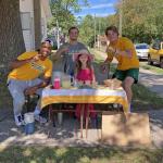 Millie with three of the Wildcat football players who bought lemonade.