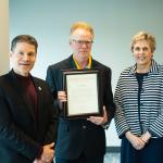 Mann (center) with Interim Provost Dale Kapla and Interim President Kerri Schuiling