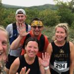 White (front center) with SLEPS colleagues and her husband completing the Four Peaks trail run last summer.