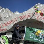 Gonzalez displays an NMU flag upon reaching Everest Base Camp