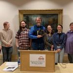 Central U.P. and NMU Archives representatives at the award ceremony (from left): Samantha Pynnonen, student employees Aura Wahl-Piotrowski and Elijah Croschere, Marcus Robyns, Annika Peterson, student employee Kaitlyn Spiegl and volunteer Karen Kasper