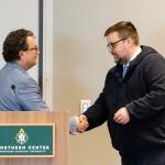 Doney (right) receiving the award from Joe Lubig, associate dean and director of Education, Leadership and Public Service