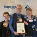 From Left: Sharon Carlson, award presenter; Marcus Robyns, university archivist and UPLINK project director; and Leslie Warren, NMU interim associate provost and dean of Library and Instructional Support