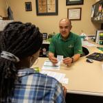 Adviser Jose Garcia with a student