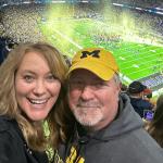 Nanette Hanson cheering on Michigan at the game (Facebook photo)